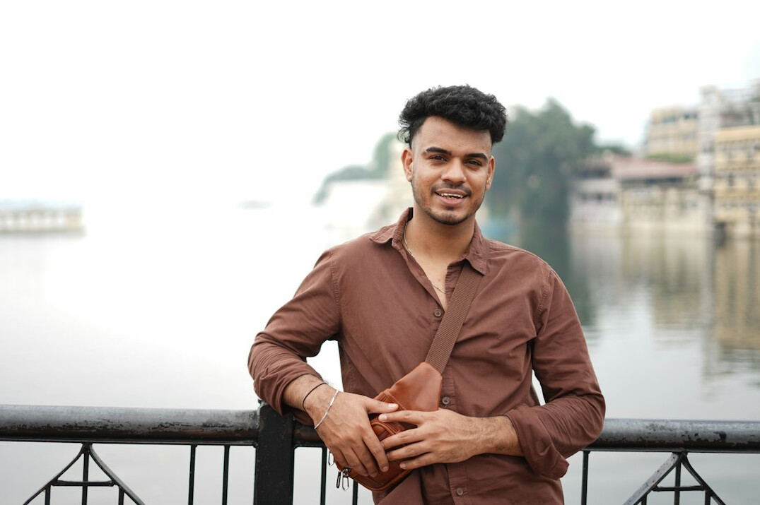Portrait of an Asian-Belgian man in his twenties in casual business attire